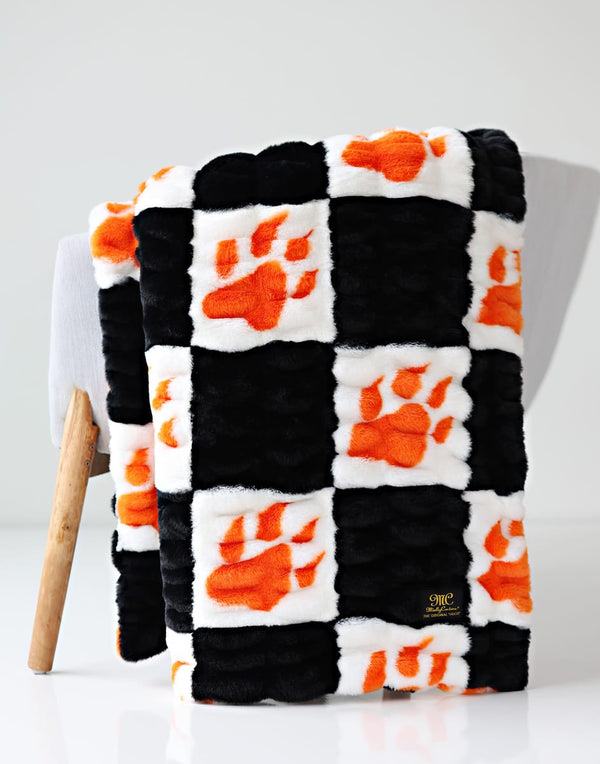 Hugs Sam Houston State Bearkats Blanket featuring a stylish black and orange paw print design.