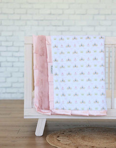 Princess Coach Blanket featuring crowns, bows, and carriages on a white background with apricot plush and satin ruffle.