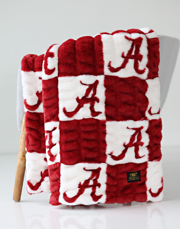 Hugs University of Alabama Crimson Tide Blanket in red and white fabric with Alabama logo pattern.