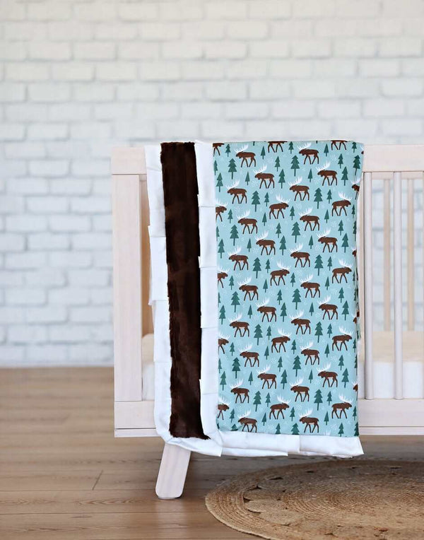 Moose Blanket featuring charming moose patterns with a plush backing, ideal for adventurous little ones.