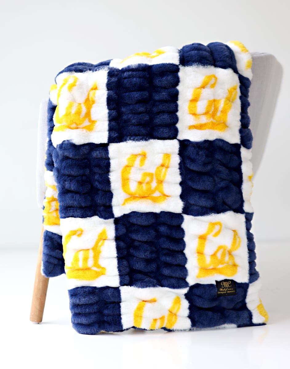 UC Berkeley Bears Blanket in navy and white, featuring the Cal logo in blocks, cozy and stylish.