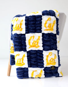 UC Berkeley Bears Blanket in navy and white, featuring the Cal logo in blocks, cozy and stylish.