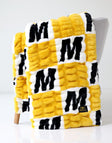 University of Missouri Tigers Blanket, soft textured blanket with black and yellow design on display.