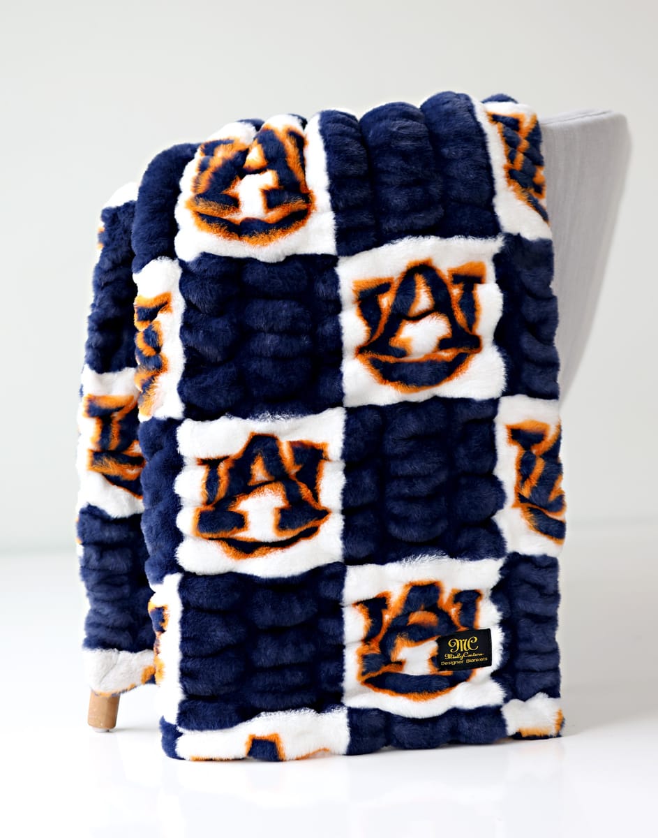 Auburn Tigers Blanket featuring soft plush fabric and vibrant team colors, perfect for fans.