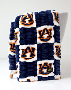 Auburn Tigers Blanket featuring soft plush fabric and vibrant team colors, perfect for fans.