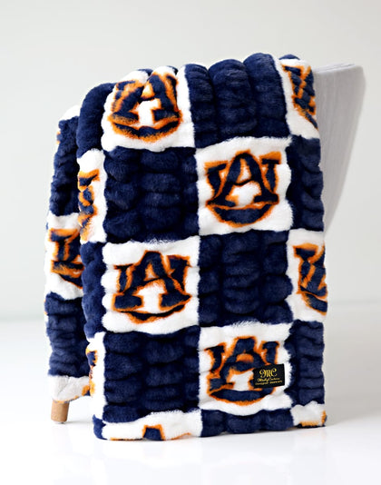 Auburn Tigers Blanket featuring soft plush fabric and vibrant team colors, perfect for fans.