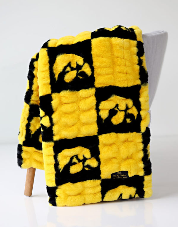 University of Iowa Blanket in black and yellow featuring a cozy plaid design, perfect for fans and warmth.