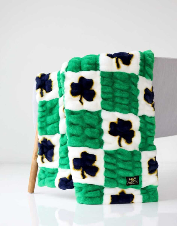 Notre Dame Fighting Irish Minky Couture blanket folded over a chair.