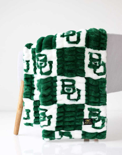 Baylor Bears Minky Couture blanket folded over a chair.