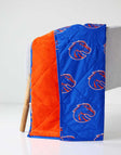 Boise State Broncos Hooded Stadium Blanket showing blue and orange sides with Broncos mascot design.
