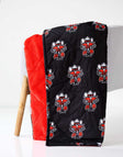 Everywhere Texas Tech Raiders Hooded Stadium Minky Couture blanket folded over a chair.