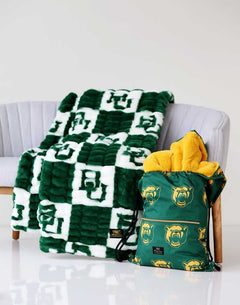 Baylor Bears Minky Couture blanket on a chair with matching drawstring bag beside it.