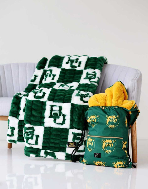Baylor Bears Minky Couture blanket on a chair with matching drawstring bag beside it.