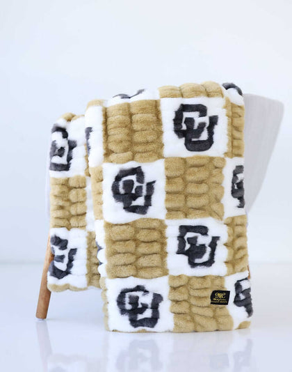 Colorado Buffaloes Blanket featuring soft, stretchy gold and cream check pattern with bold CU logos.