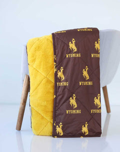 Wyoming Cowboys Hooded Stadium Blanket featuring brown and yellow plush fabric with Wyoming logo.