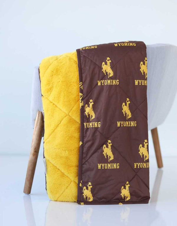 Wyoming Cowboys Hooded Stadium Blanket featuring brown and yellow plush fabric with Wyoming logo.