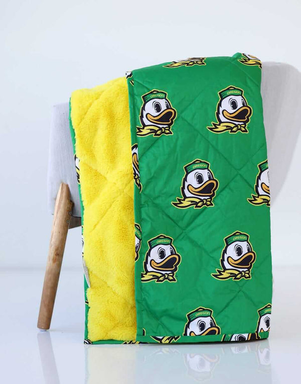University of Oregon Ducks Hooded Stadium Blanket featuring vibrant green and yellow plush design.