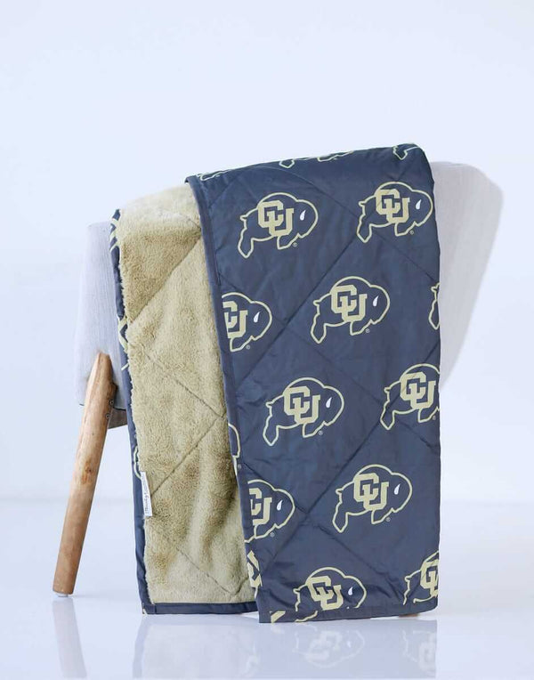 Colorado Buffaloes Hooded Stadium Blanket displayed on a chair, featuring a bold Buffalo logo.