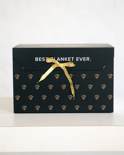 Gift Box featuring elegant gold detailing and ribbon, ideal for sending the Best.Gift.Ever.