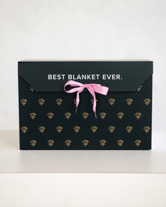 Elegant gift box with the text 'BEST BLANKET EVER' featuring a pink ribbon, perfect for gifting cozy blankets.