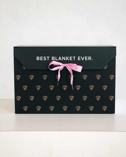 Elegant gift box with the text 'BEST BLANKET EVER' featuring a pink ribbon, perfect for gifting cozy blankets.