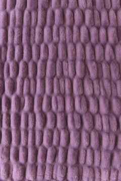 A close-up of a lavender-purple colored blanket.