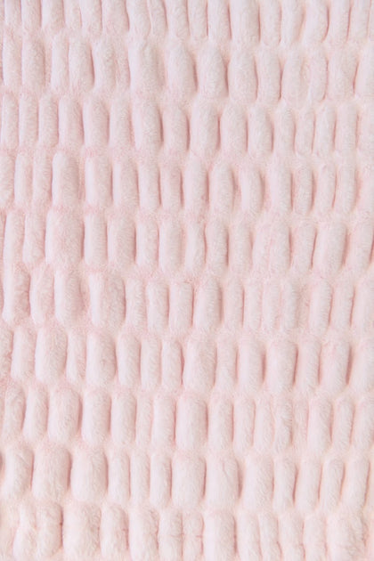 Close-up of a textured pink fabric blanket

