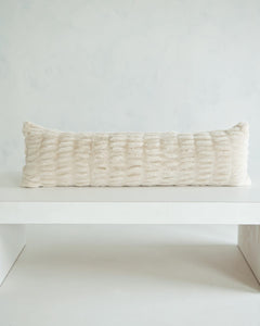 Hugs Ancient Scroll Sham on a white table, showcasing its soft and cozy texture in timeless off-white.