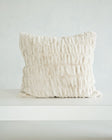 Hugs Ancient Scroll Sham showcasing its soft and cozy off-white fabric on a minimalist background.