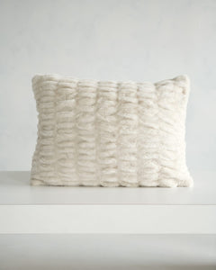 Hugs Ancient Scroll Sham displayed on a table, showcasing its soft, cozy texture in off-white.