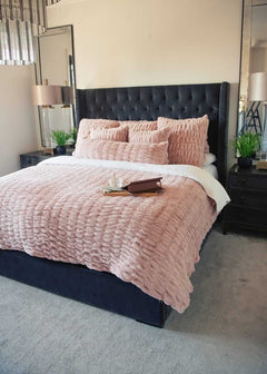 Pink Minky Couture Hugs Blush Duvet bedding styled on a bed.