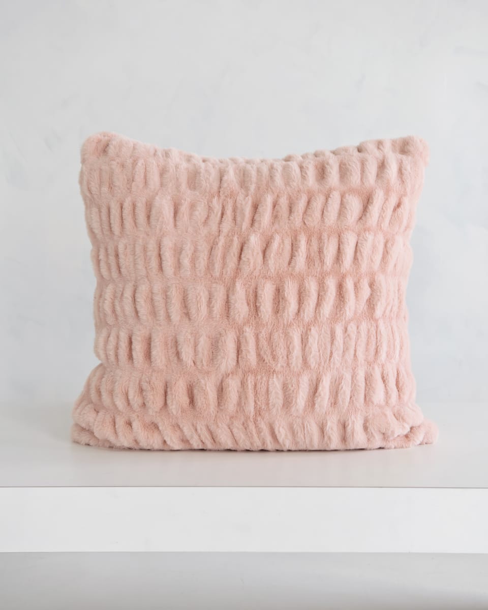 Cozy Hugs Blush Sham in soft pink fabric, perfect for adding comfort to any space.