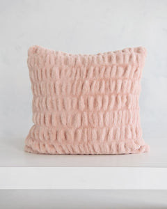 Cozy Hugs Blush Sham in soft pink fabric, perfect for adding comfort to any space.