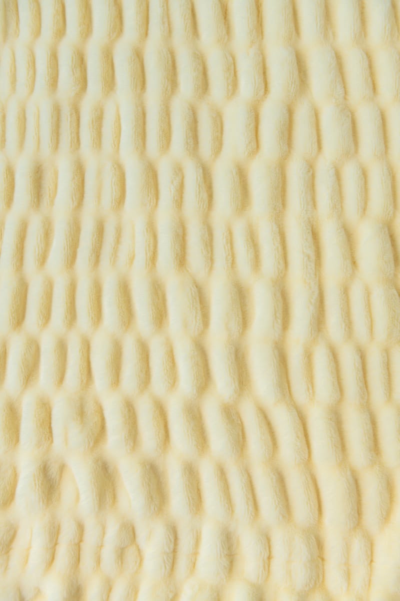 Close-up of a textured yellow fabric