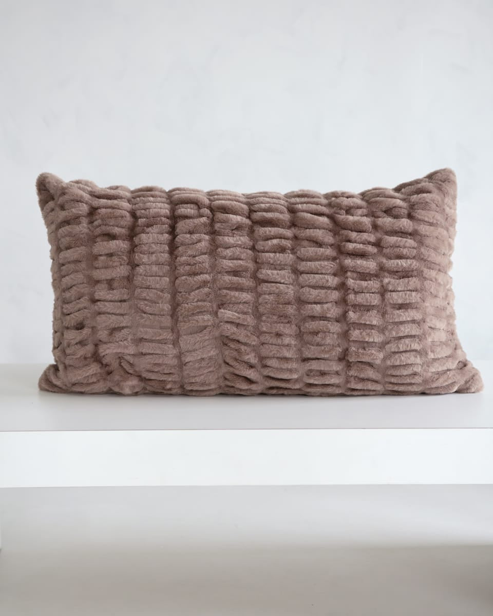 Hugs Milk Chocolate Sham on a white surface with a cozy textured design in light brown.