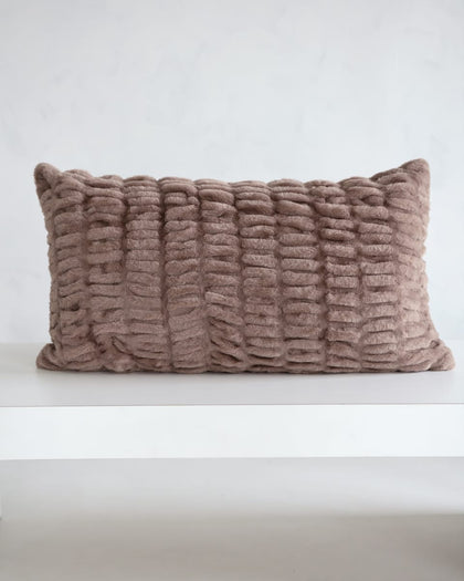 Hugs Milk Chocolate Sham on a white surface with a cozy textured design in light brown.