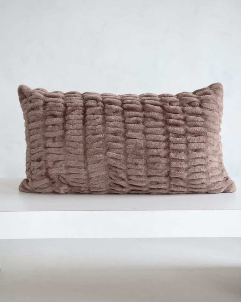 Hugs Milk Chocolate Sham on a white surface with a cozy textured design in light brown.