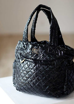Patent Leather Black Everything Bag with stylish quilted design and elegant logo embellishment.