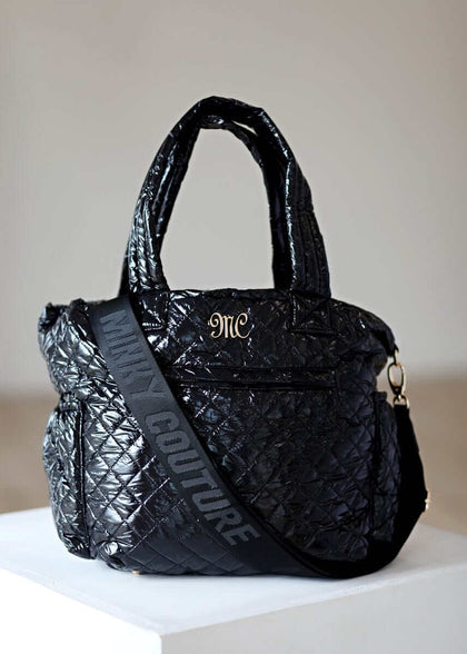 Everything Bag Patent Leather Black with quilted design, perfect for travel or daily use.