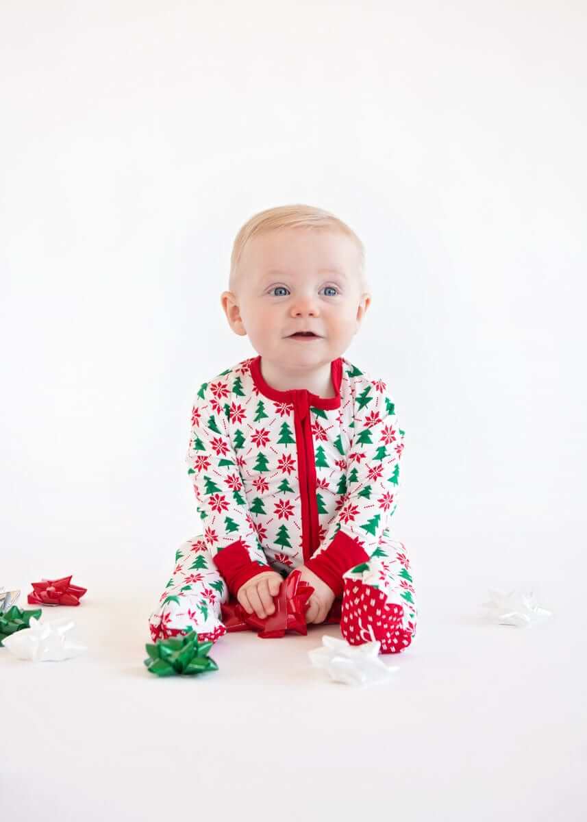 Infant Unisex Zipper Footie with Poinsettia and Tree, perfect for holiday celebrations with festive design.