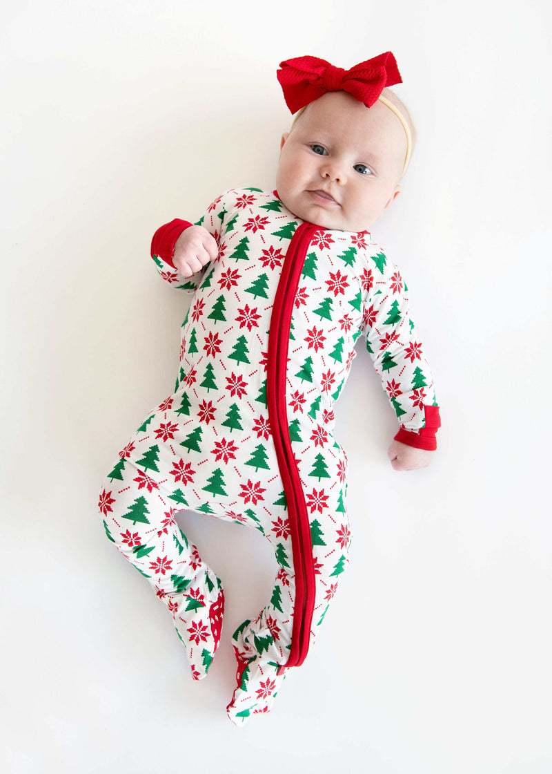 Infant Unisex Zipper Footie with Poinsettia and Tree featuring a baby in festive holiday design with red accents.