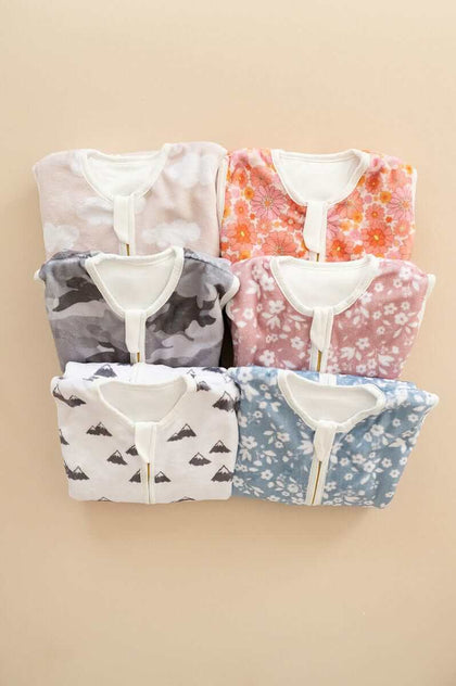Wearable Minky Blankets collection featuring various patterns and colors in a laid out arrangement.