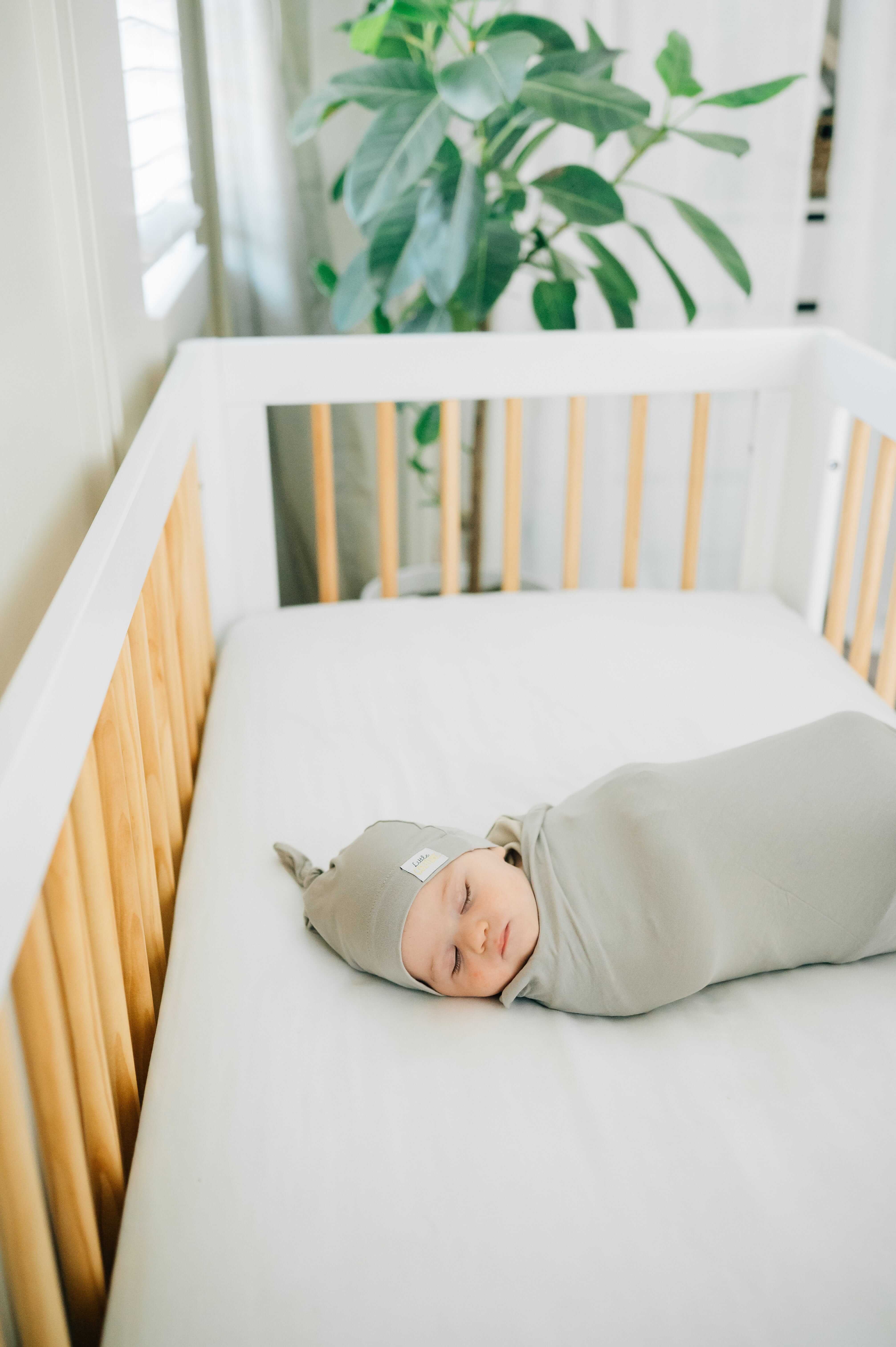 Tranquil Dove Swaddle and Hat, a cozy bamboo swaddle and matching hat for a snug baby sleep.