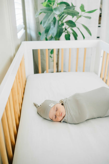 Tranquil Dove Swaddle and Hat, a cozy bamboo swaddle and matching hat for a snug baby sleep.