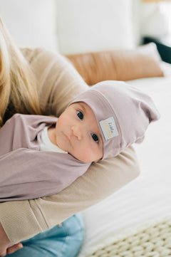 Blueberry Cheesecake Swaddle and Hat combo, soft baby in matching hat and swaddle for cozy sleep.