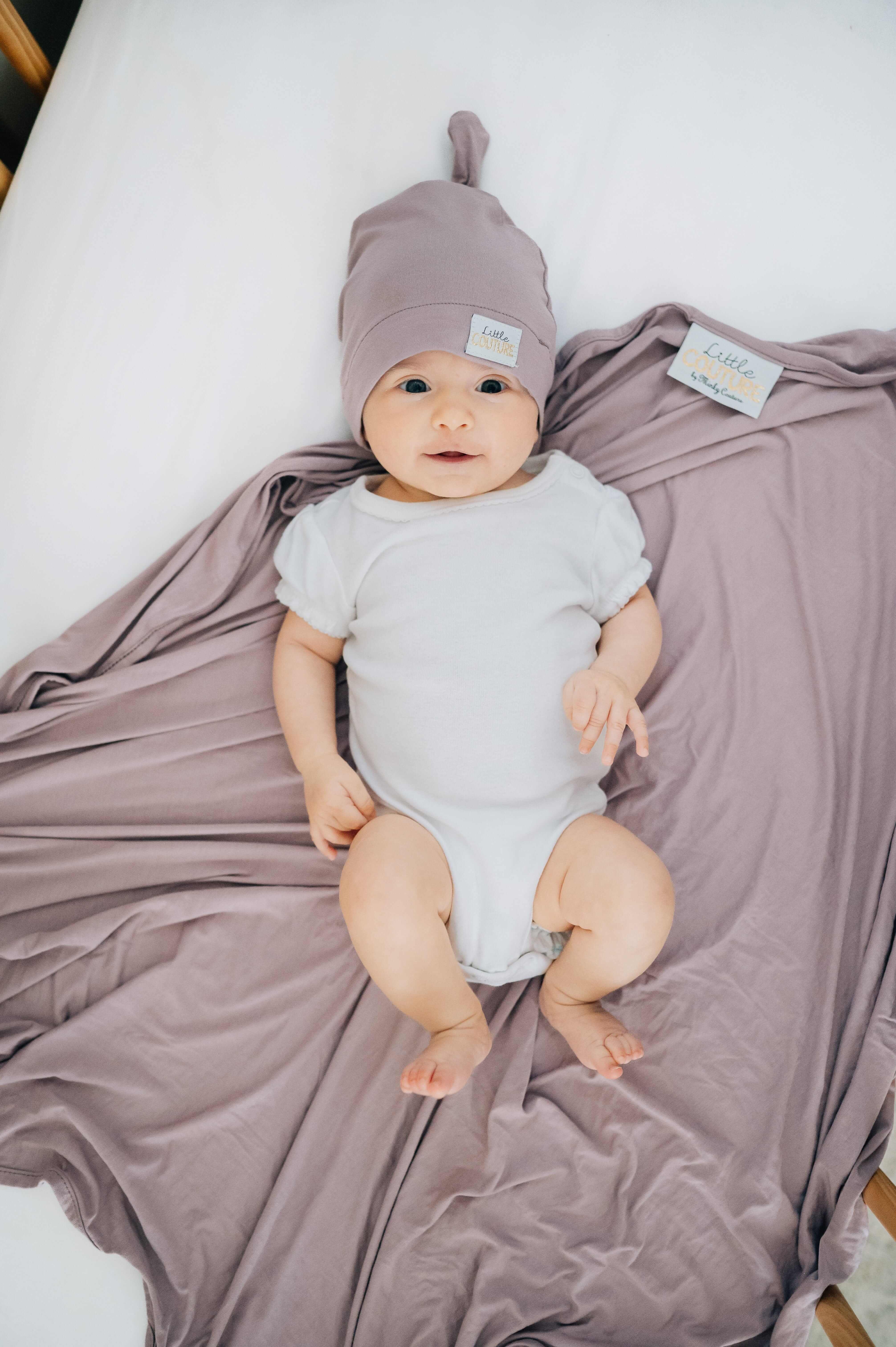 Blueberry Cheesecake  Swaddle and Hat combo featuring a cute baby in a cozy swaddle and hat.