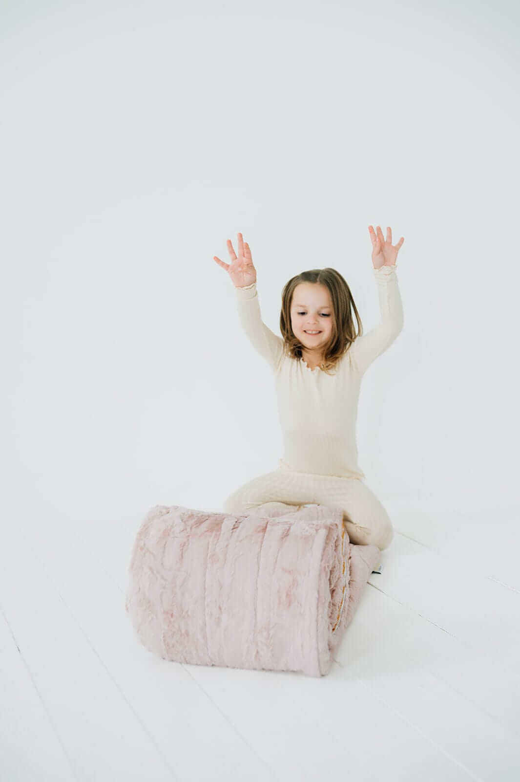 Child enjoying the cozy Sleeping Bag Blush from Little Couture by Minky Couture.