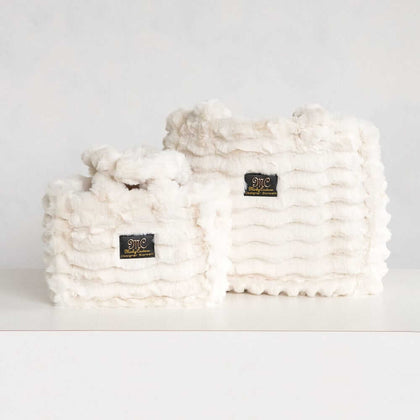 Two cream Minky Couture Annie bags in different sizes displayed side by side on a white background.