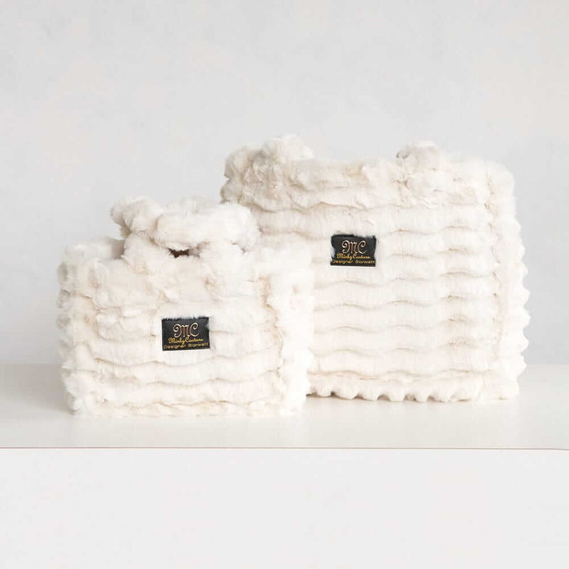 Two cream Minky Couture Annie bags in different sizes displayed side by side on a white background.