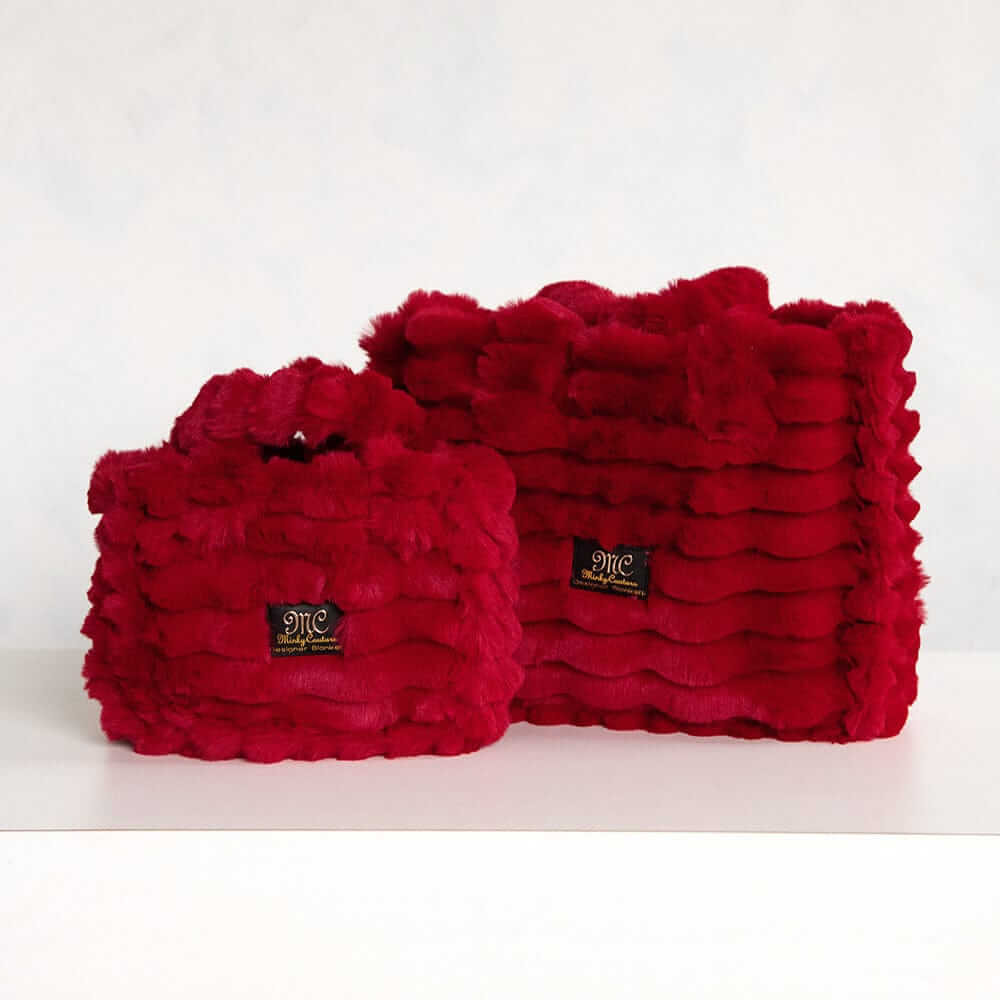 Two red Minky Couture Annie bags Ripple Crimson in different sizes displayed side by side.